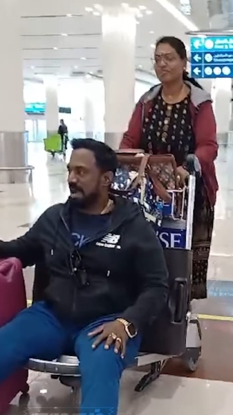 Actor Robo Shankars wife pushing Robo Shankar in a cart Actor Robo Shankars wife pushing Robo Shankar in a cart