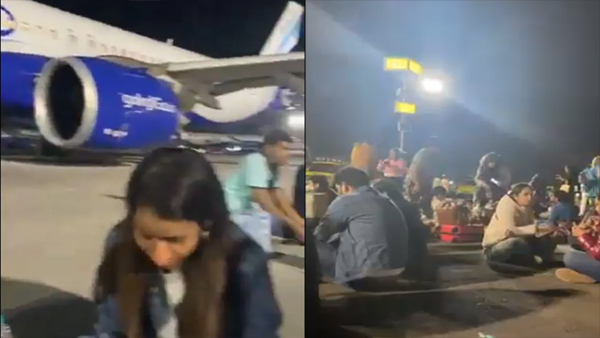 passengers-eat-food-on-the-tarmac-near-indigo-aircraft-in-mumbai