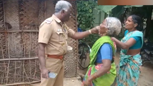 Dharmapuri mother and daughter pouring dung on SSI and Surveyor, now arrested Dharmapuri mother and daughter pouring dung on SSI and Surveyor, now arrested