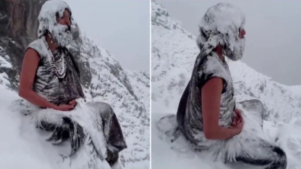 Yogi meditating in snow-clad mountains of Himachal Pradesh 