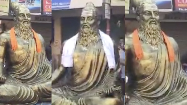 BJP members put saffron cloth Thiruvalluvar statue during Modi road show BJP members put saffron cloth Thiruvalluvar statue during Modi road show