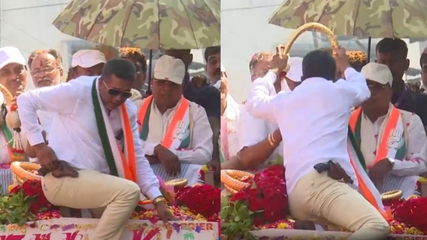 Man with Gun on his belt gets close to Siddaramaiah to wear garland at Banaglore rally Man with Gun on his belt gets close to Siddaramaiah to wear garland at Banaglore rally