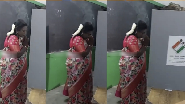 South chennai BJP candidate Tamilisai soundararajan stands with bowed hands infront of EVM Machine