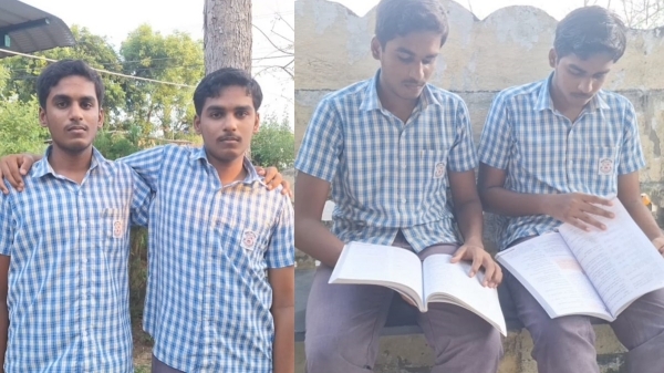 Two twin sisters have scored same marks in the 10th examination result Two twin sisters have scored same marks in the 10th examination result