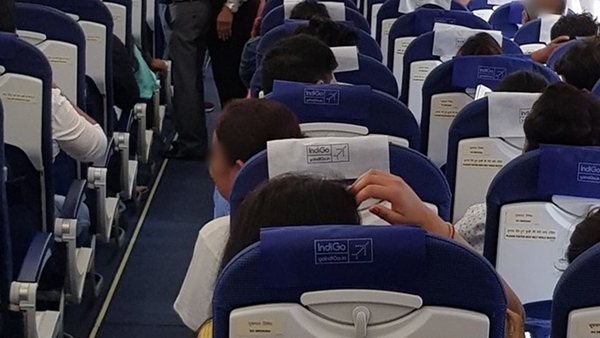 Engineer secretly photographed a young woman on his cell phone while Chennai flight was in mid-air