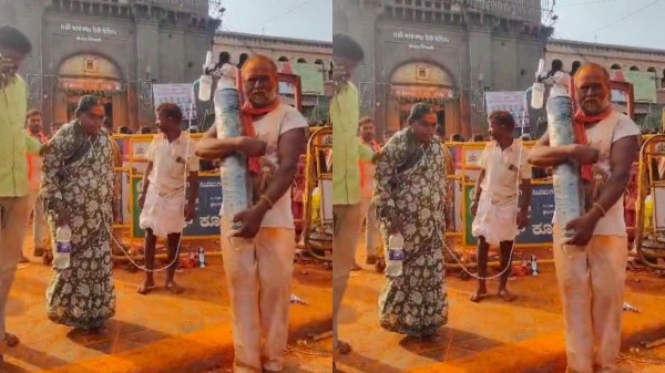 Husband carries oxygen cylinder for wife Husband carries oxygen cylinder for wife