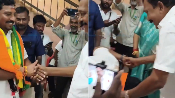 AIADMK candidate Sudhakar fell at the feet of DMK candidate Govindarajan and sought his blessings AIADMK candidate Sudhakar fell at the feet of DMK candidate Govindarajan and sought his blessings
