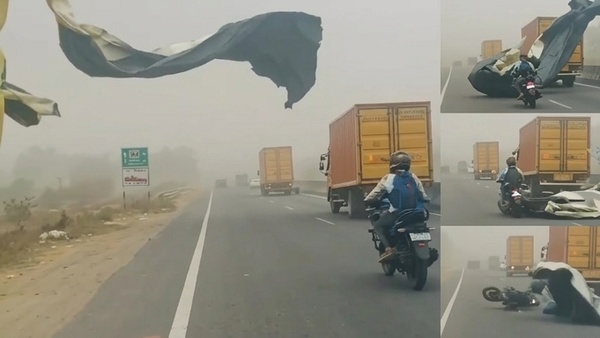 torn-banner-to-fall-onto-a-moving-bike-on-coimbatore-trichy-highway-near-palladam-in-tiruppur torn-banner-to-fall-onto-a-moving-bike-on-coimbatore-trichy-highway-near-palladam-in-tiruppur
