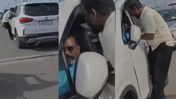 VCK functionary chats with Thirumavalavan while holding onto the car door at 60 km h Speed