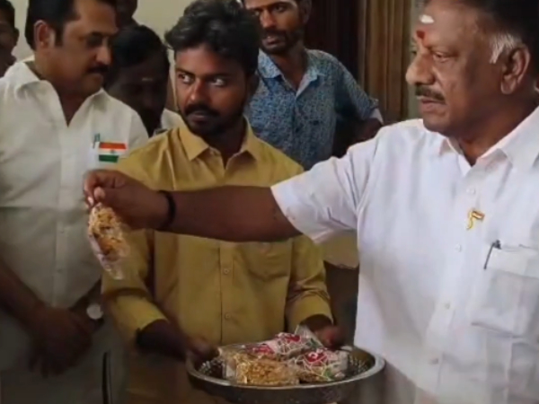 OPS Hoists National Flag Distributes Mixture to Cadres in Theni