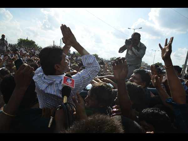 ప్రజలకు అభివాదం చేస్తూ...