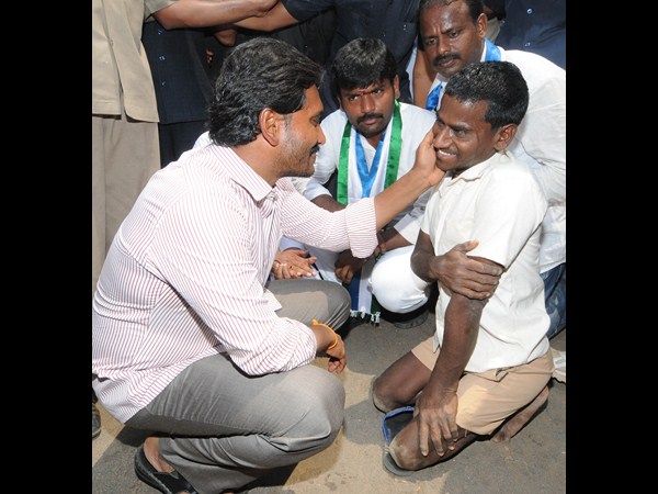 వికలాంగుడితో మాట్లాడుతూ..