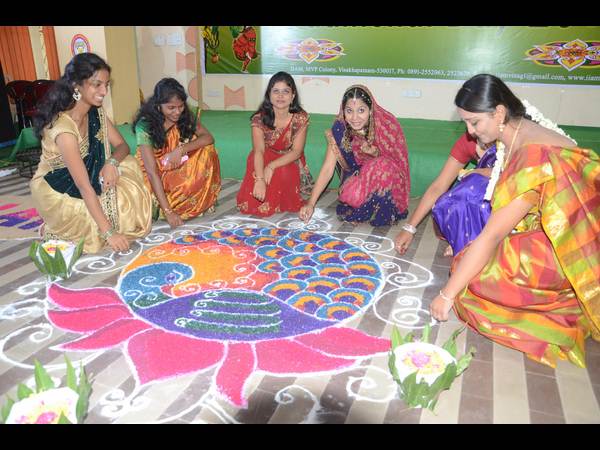 ముగ్గులు పెడుతూ...
