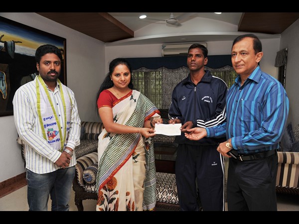  Kavitha Gives Rs 1.5L Assistance to Cop for Swimming Contest