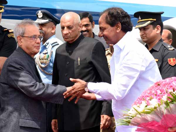 CM KCR catches Pranab's legs