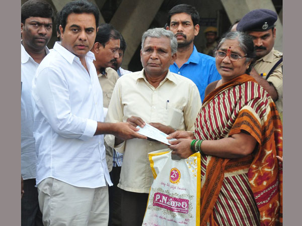 ktr hands over 10 lakh cheque to gokul bomb blast sufferers ktr hands over 10 lakh cheque to gokul bomb blast sufferers