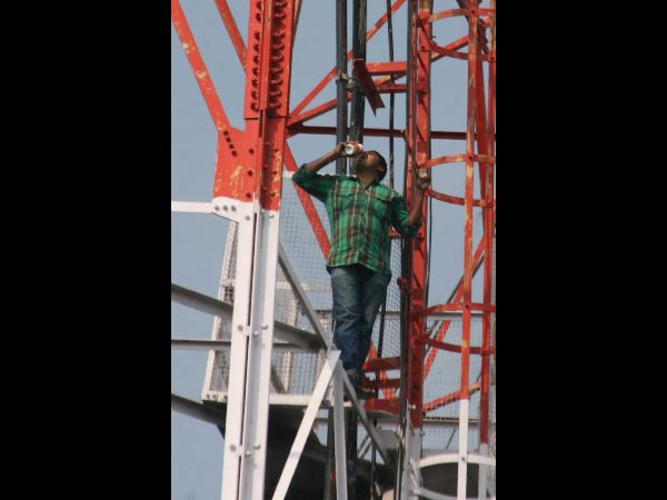Farmer threatens to jump from cell tower