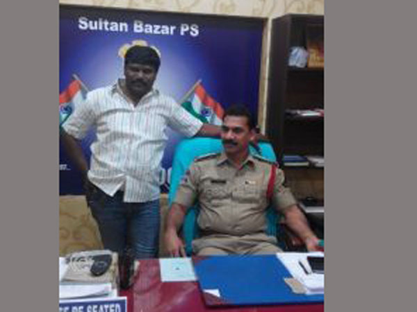 Friendly policing? Offender sits in inspector's chair, clicks pics with him