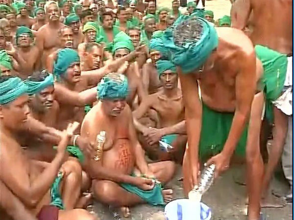 Protesting Tamil Nadu farmers drink urine Protesting Tamil Nadu farmers drink urine
