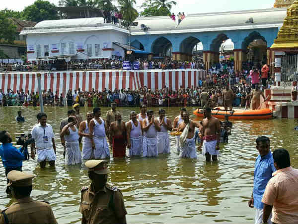 Tamil Nadu CM Ministers take holy dip in Cauvery