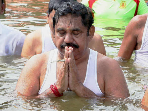 Tamil Nadu CM Ministers take holy dip in Cauvery