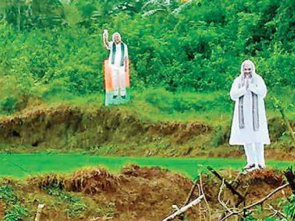 Modi and Shah cut outs used as scarecrows in Karnataka fields