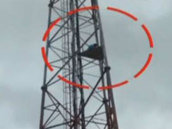 Man Climbs Cell Tower, Demands AP Special Status In Anantapur Man Climbs Cell Tower, Demands AP Special Status In Anantapur