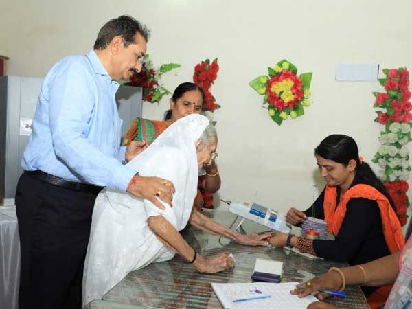 Social activist Anna Hazare in Maharashtra and Narendra Modis mother, Heeraben in Gujarat cast their Votes