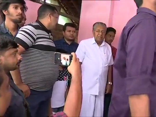 Kerala Chief Minister Pinarayi Vijayan queues up to casts his vote Kerala Chief Minister Pinarayi Vijayan queues up to casts his vote