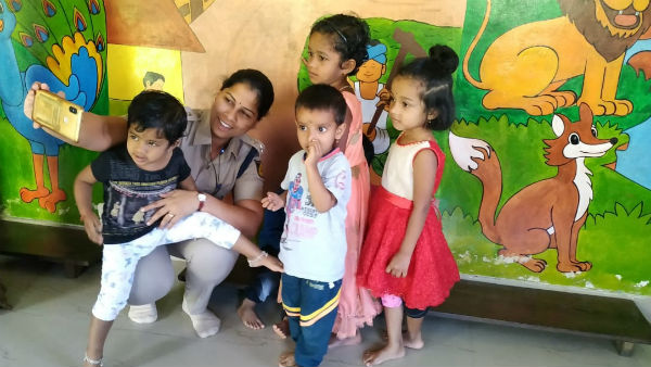 Madikeri SP Dr Suman D Pannekar enroll his daughter to anganawadi Madikeri SP Dr Suman D Pannekar enroll his daughter to anganawadi