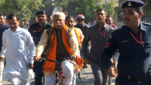 Haryana CM Manohar Lal Khattar rides cycle to polling station Haryana CM Manohar Lal Khattar rides cycle to polling station