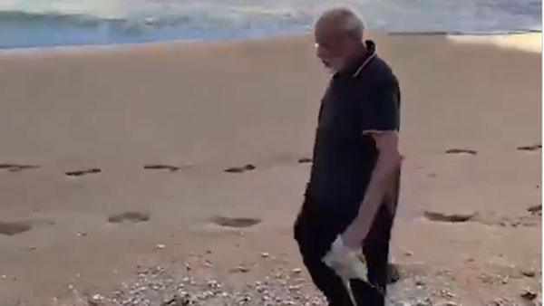 PM Modi in his morning walk in cleans kovalam beach PM Modi in his morning walk in cleans kovalam beach