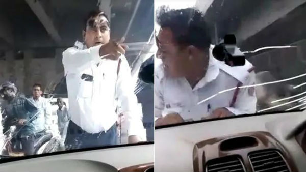 కారును ఆపిన పోలీసు అధికారి..