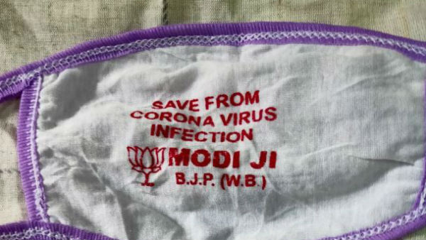 West Bengal BJP leaders distributing the Coronavirus masks with Party logo and Modi 
