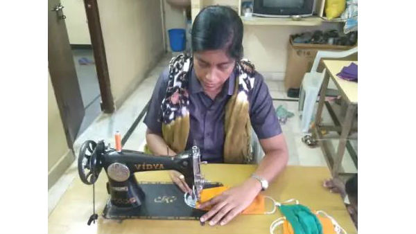 Woman Constable B Amareswari stitching and distributing masks in Hyderabad