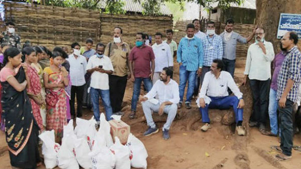 భుజంపై సరుకుల బస్తాలు మోస్తూ కొండల్లో నడిచిన ఎమ్మెల్యే 