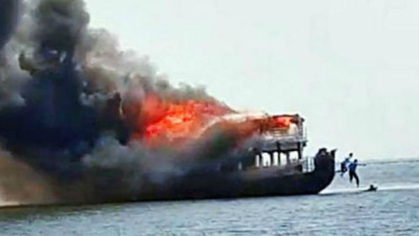 fishing boat catches fire in visakhapatnam fishing boat catches fire in visakhapatnam