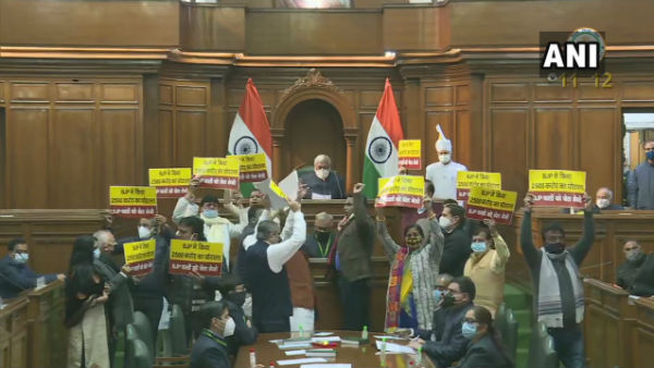 Aam Aadmi Party MLAs display placards and banner alleging BJP of a Rs 2,500 crores scam Aam Aadmi Party MLAs display placards and banner alleging BJP of a Rs 2,500 crores scam