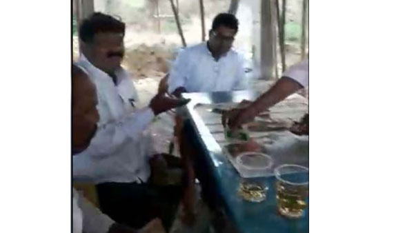  Alcohol drunken MEO and teachers played poker at school in adilabad district