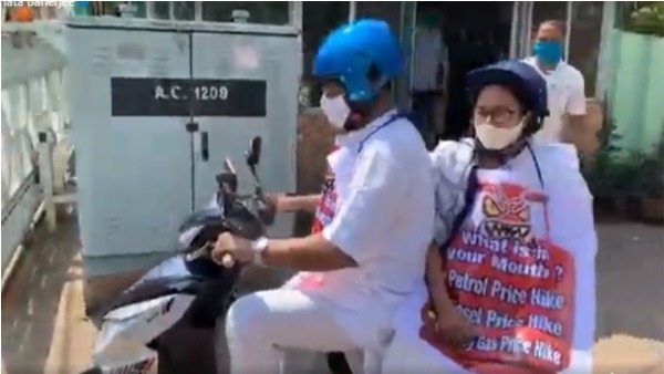 CM Mamata Banerjee travels on an electric scooter protest against rising fuel prices CM Mamata Banerjee travels on an electric scooter protest against rising fuel prices