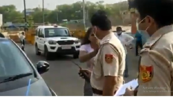 మా కారు ఎందుకు ఆపారంటూ పోలీసులపై దురుసుగా ప్రవర్తించిన జంట 