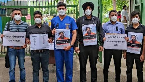  Baba Ramdevs comments on allopathy: Doctors protest with slogans on PPE, black bands
