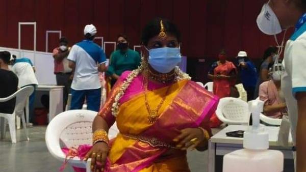 A bride gets Covid19 vaccine in a wedding gown at Hytex in Hyderabad during mega vaccination A bride gets Covid19 vaccine in a wedding gown at Hytex in Hyderabad during mega vaccination