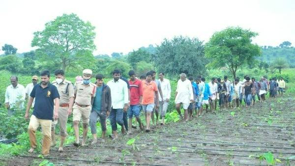 mla methuku anand carries body of a newly wed bride who washed away in flooded stream