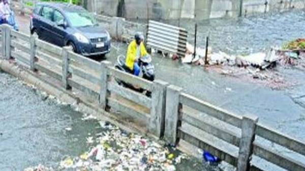 weather: heavy rains in Hyderabad: water flows over amberpet-moosarambagh bridge. weather: heavy rains in Hyderabad: water flows over amberpet-moosarambagh bridge.