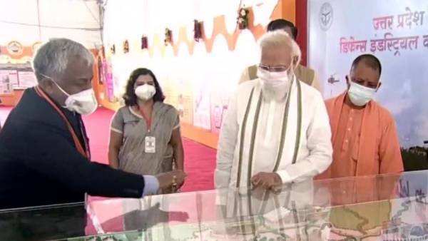 pm modi praises up chief minister yogi adityanath for his work towards development 
