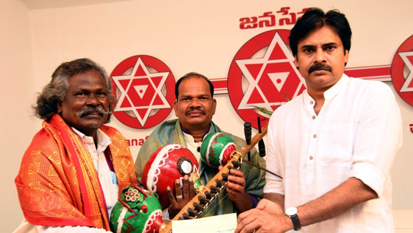 pawan kalyan handed cash cheque to mogulaiah