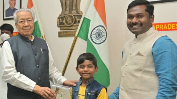 IAS officer Gandham Chandrudu and his son Bhuvan meets AP Governor vishwa bhushan harichandan IAS officer Gandham Chandrudu and his son Bhuvan meets AP Governor vishwa bhushan harichandan