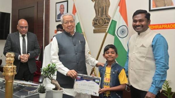 IAS officer Gandham Chandrudu and his son Bhuvan meets AP Governor vishwa bhushan harichandan IAS officer Gandham Chandrudu and his son Bhuvan meets AP Governor vishwa bhushan harichandan