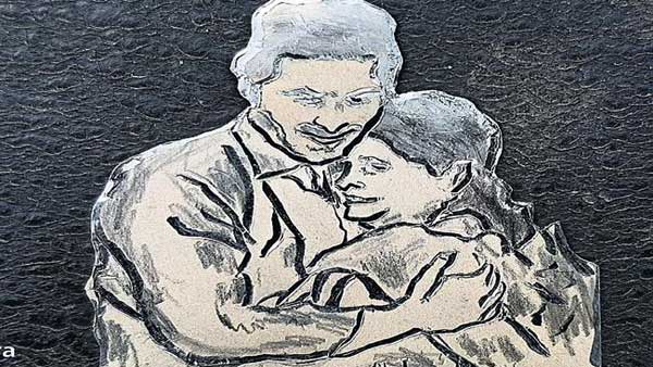 వెండి నాణెం పై జగన్, విజయమ్మల చిత్రం